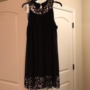 Black cocktail dress with sequin trim